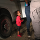 A 2-year-old Honduran child cries as her mother, seeking asylum for them, is searched and detained by U.S. Border Patrol agents near the U.S.-Mexico border on June 12, 2018, in McAllen, Texas.